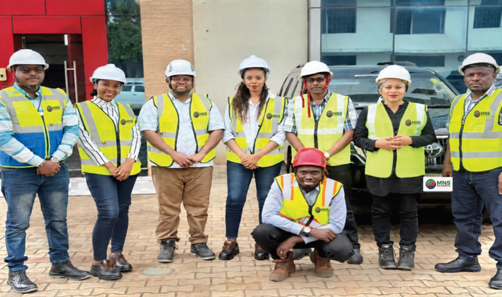 MNS management and technical team wearing safety equipment